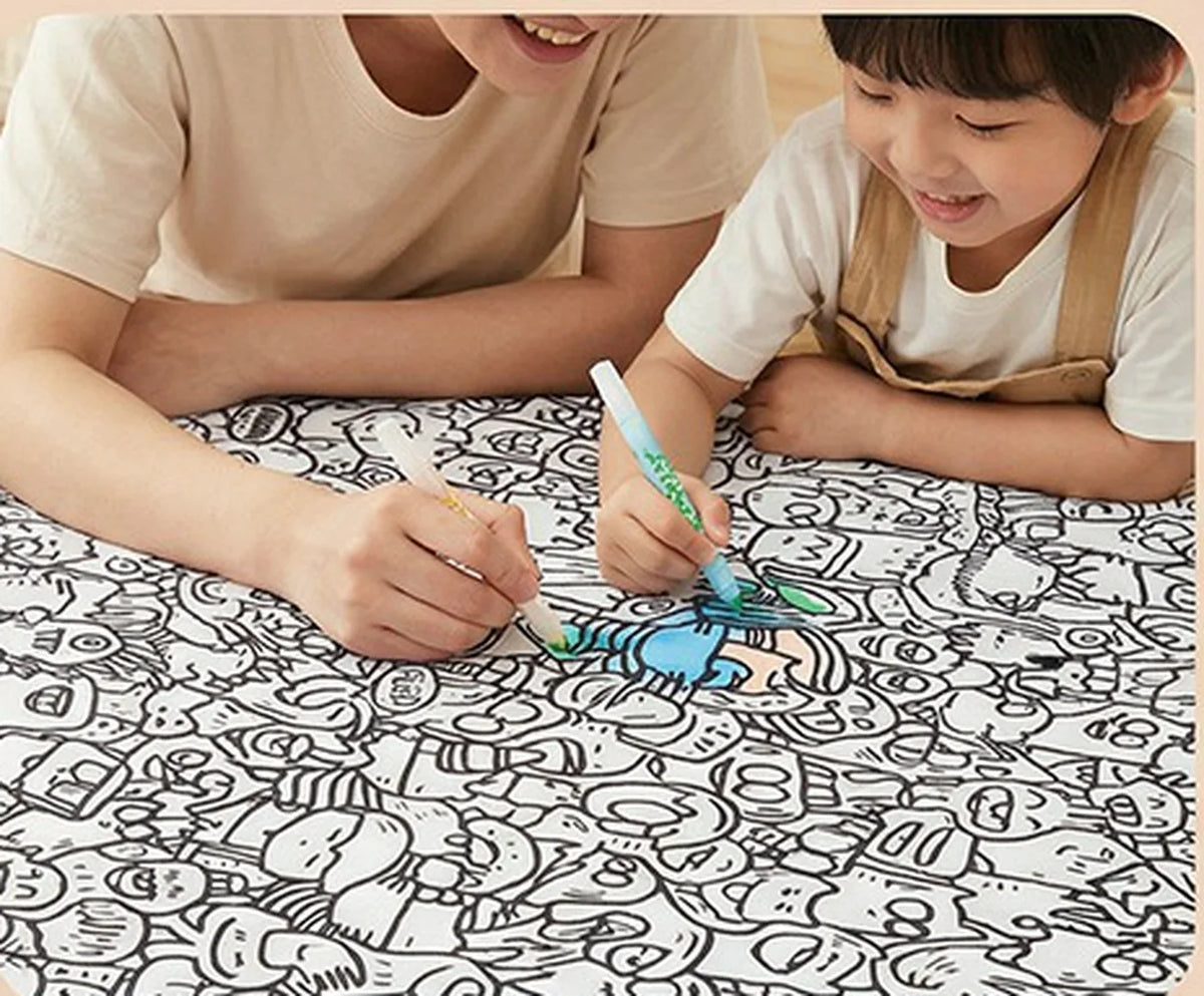 Parent and child colouring the Tinta Blanket