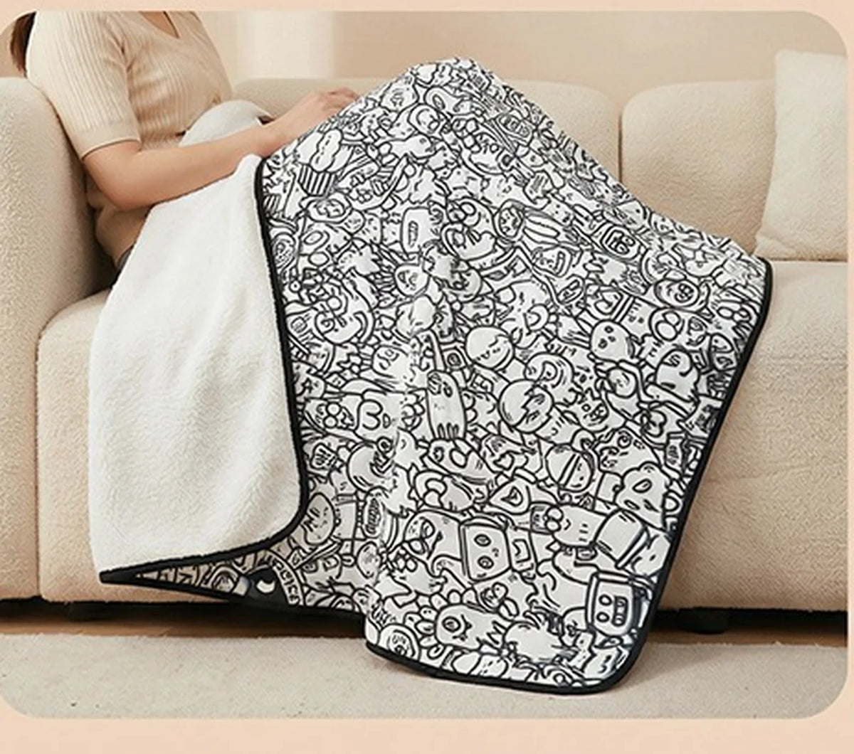 Tinta Blanket draped on a sofa showing the soft sherpa lining