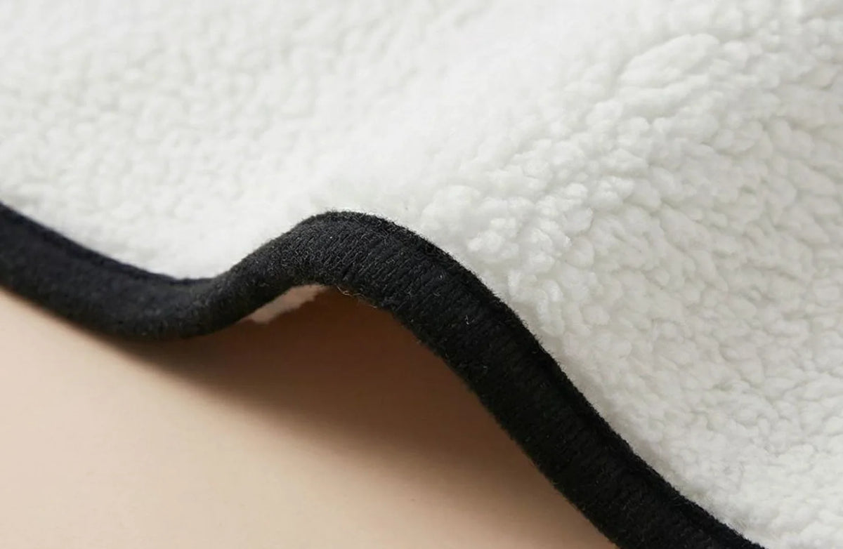 Detail of the soft sherpa backing and stitched edge